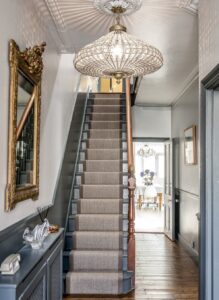 Victorian hallway with large chandelier